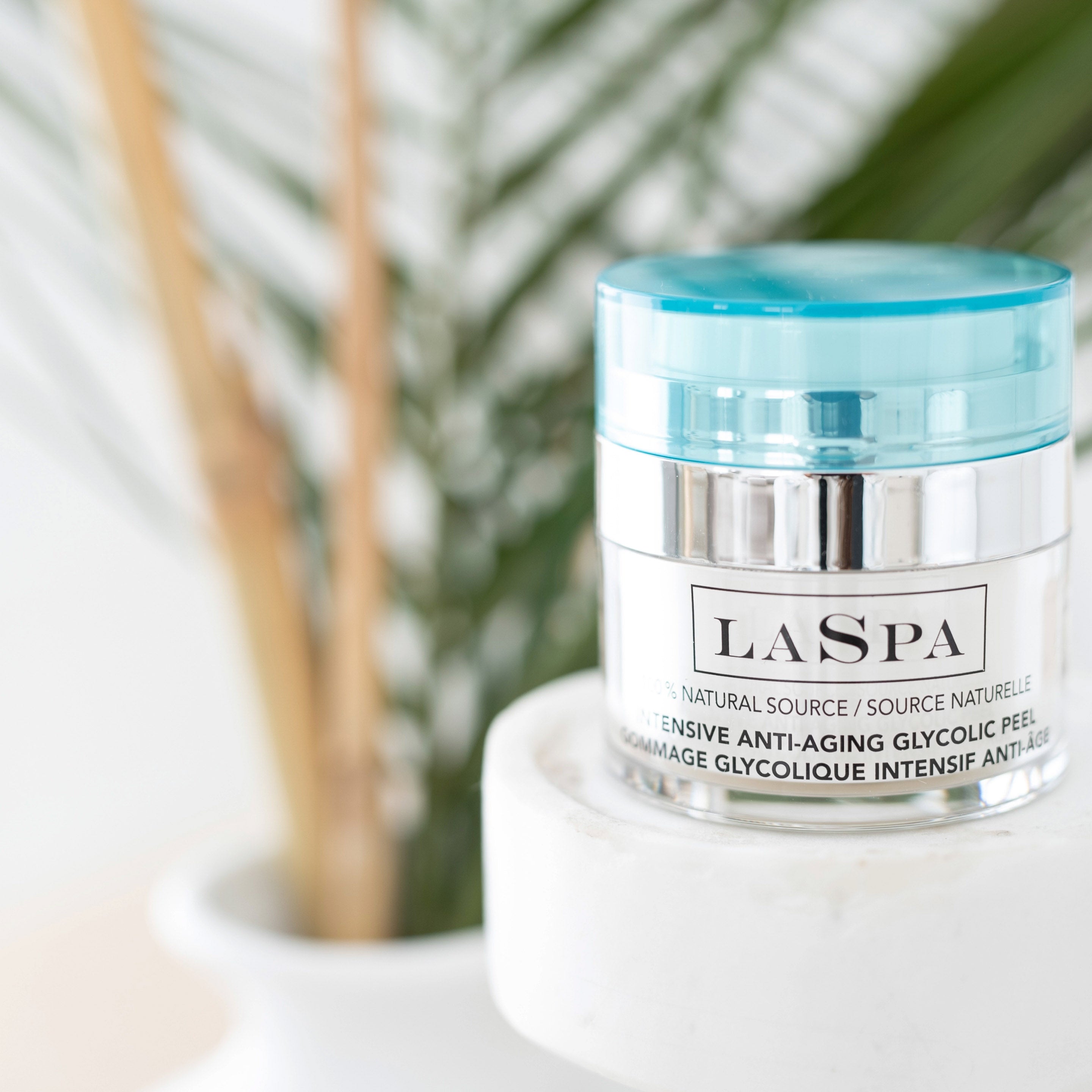 LASPA Intensive Anti-Aging Glycolic Peel in front of plants